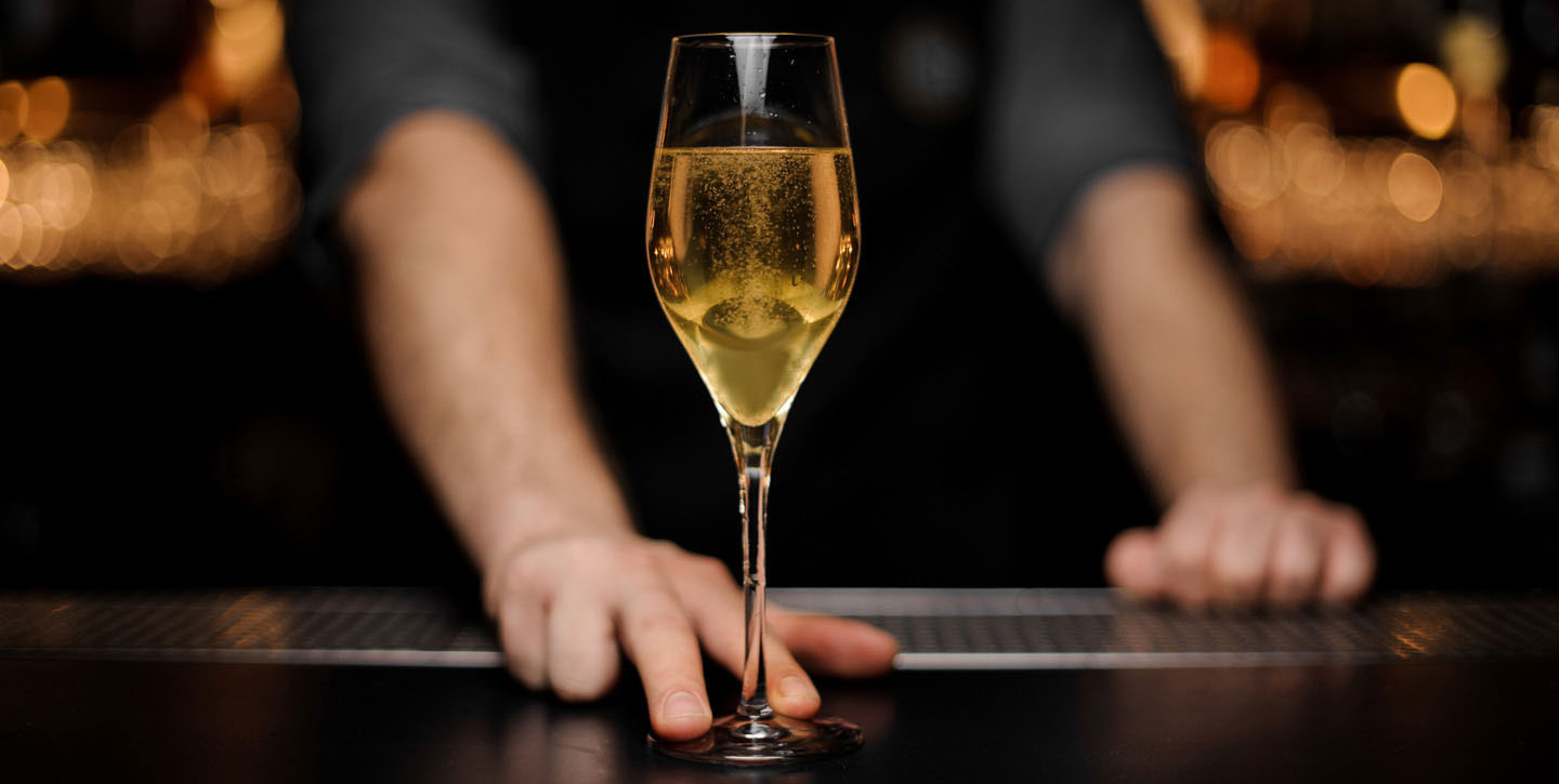 Bottle Bank - The Experience - Bartender Serves Quality Glass of Champagne